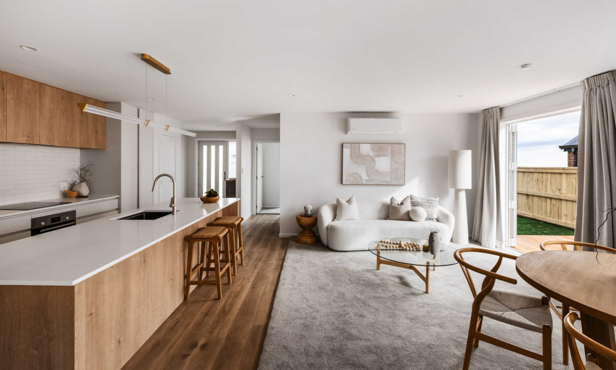 View of open living, dining and kitchen